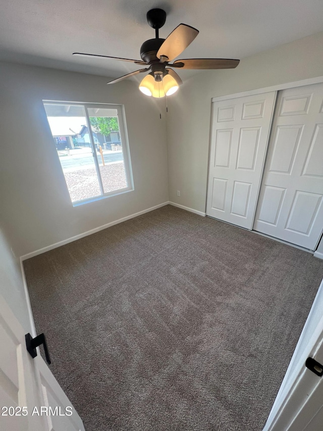 1545 W Marco Polo Rd, Phoenix, AZ 85027 - unfurnished bedroom with carpet floors, a closet, baseboards, and ceiling fan