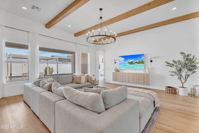10006 E Rotation Dr, Mesa, AZ 85212 - living area with beamed ceiling, a chandelier, hardwood / wood-style flooring, recessed lighting, and baseboards
