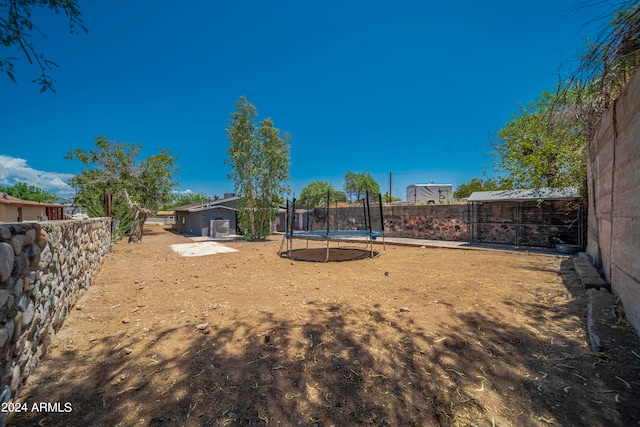 view of yard featuring a trampoline