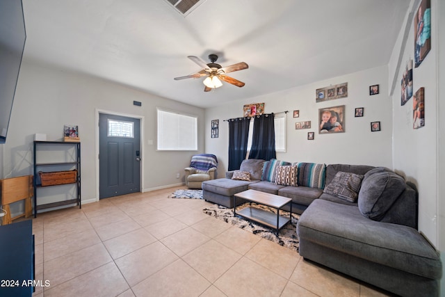 tiled living room featuring ceiling fan