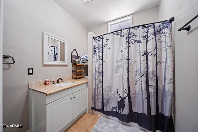 bathroom with vanity and tile patterned floors