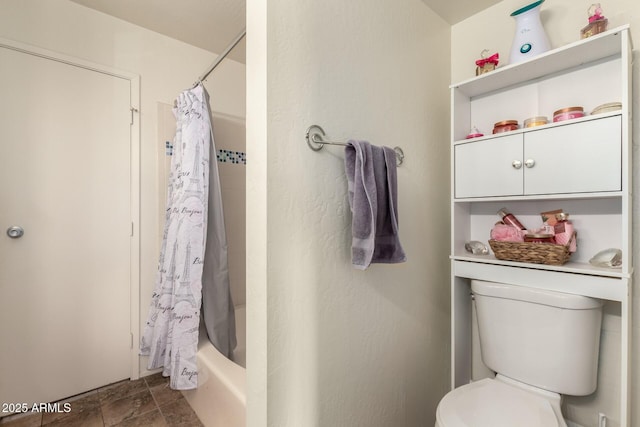 bathroom with toilet and shower / bath combination with curtain