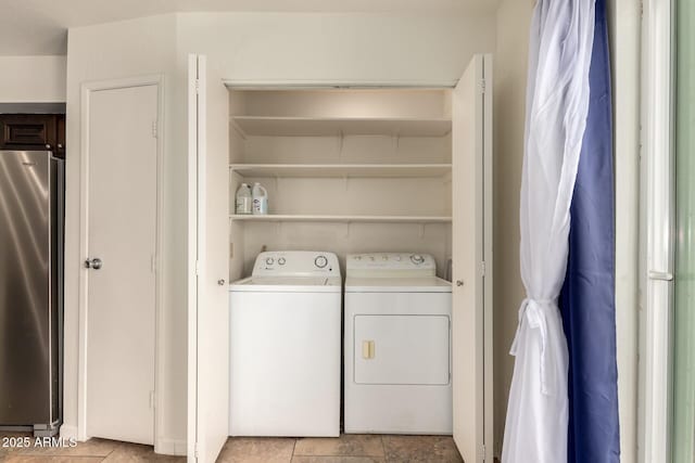 washroom featuring laundry area and washing machine and clothes dryer