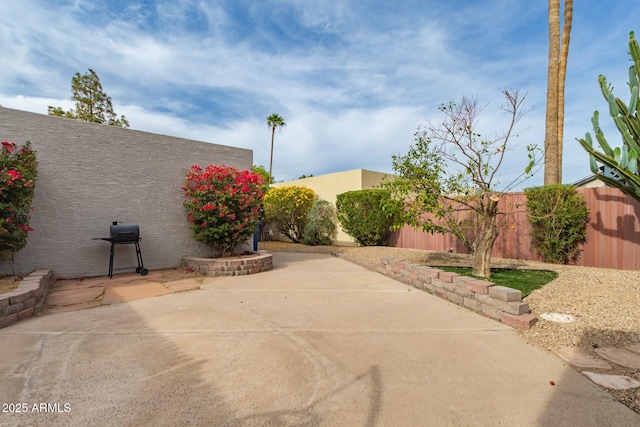 view of patio / terrace featuring area for grilling and a fenced backyard