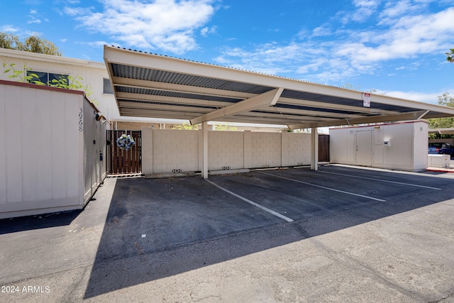 view of parking / parking lot with a carport