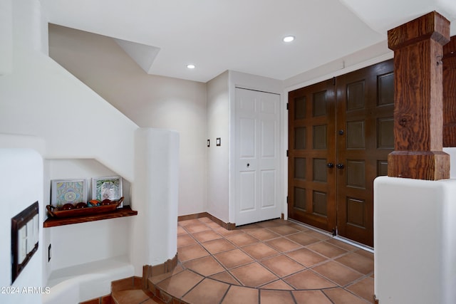 foyer featuring light tile floors