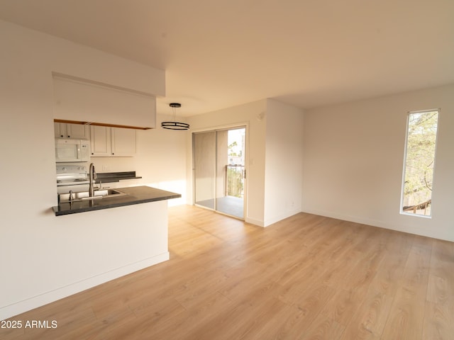 interior space with sink and light wood-type flooring