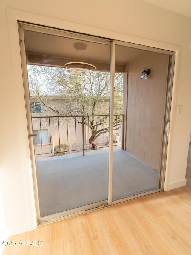 entryway with hardwood / wood-style flooring