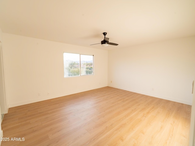 empty room featuring light hardwood / wood-style floors and ceiling fan