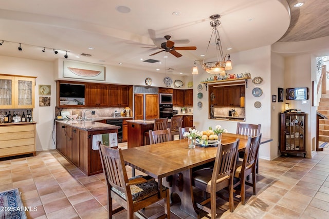 25002 N Quail Haven Dr, Rio Verde, AZ 85263 - dining area with stairway, a ceiling fan, recessed lighting, and light tile patterned floors