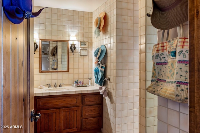 25002 N Quail Haven Dr, Rio Verde, AZ 85263 - bathroom featuring tile walls, vanity, and tasteful backsplash