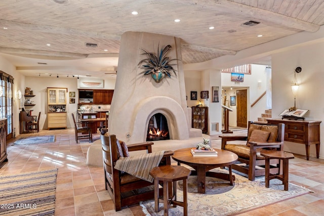 25002 N Quail Haven Dr, Rio Verde, AZ 85263 - living room featuring stairs, wood ceiling with exposed beams, a large fireplace, recessed lighting, and ceiling fan