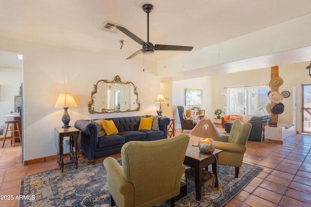 tiled living room with a ceiling fan, baseboards, and visible vents