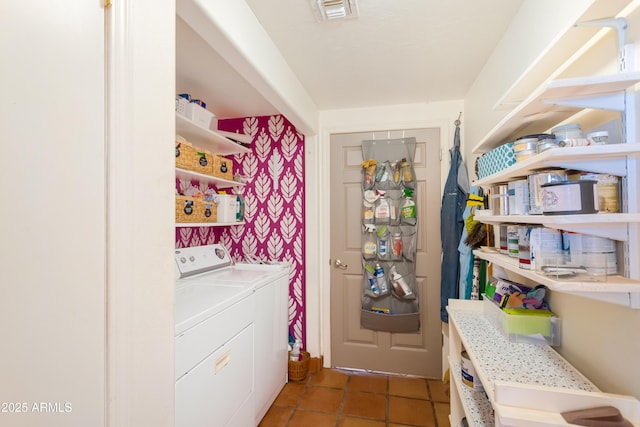 washroom with light tile patterned floors, laundry area, and visible vents