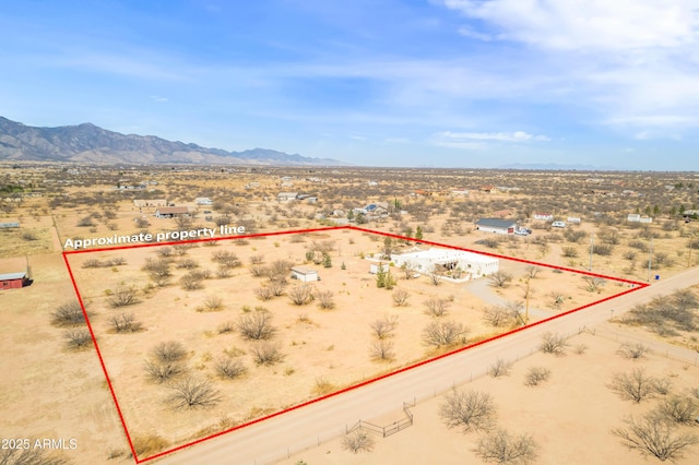 birds eye view of property with a mountain view, view of desert, and a rural view