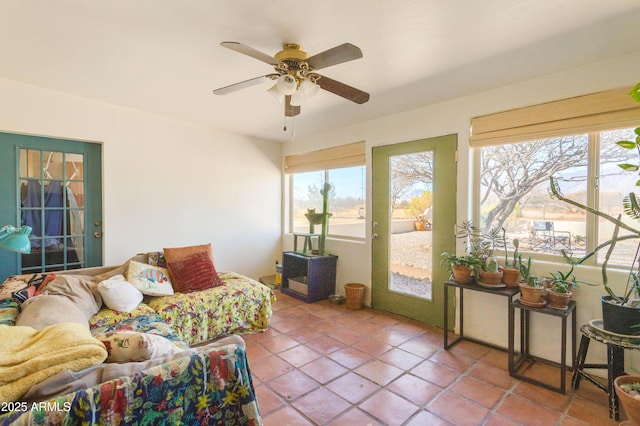 interior space featuring a ceiling fan and access to outside