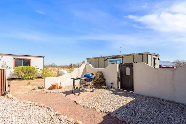 view of yard featuring a gate and fence