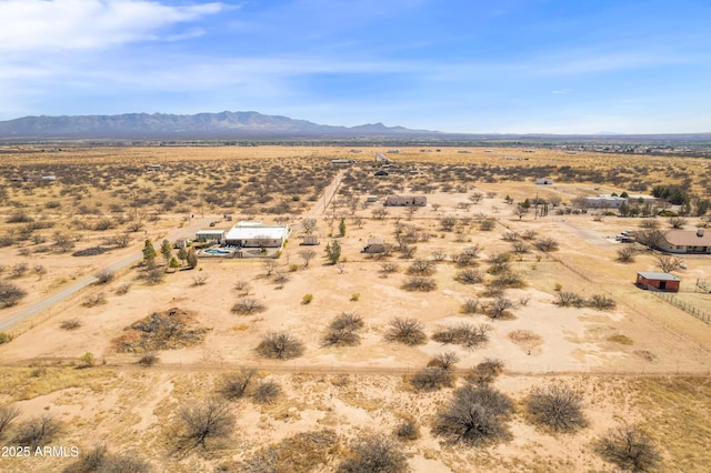 mountain view featuring view of desert and a rural view