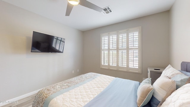 bedroom featuring ceiling fan and hardwood / wood-style floors