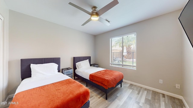 bedroom featuring light hardwood / wood-style floors and ceiling fan