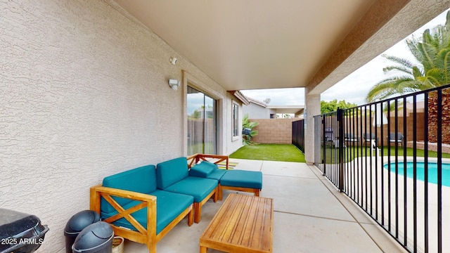 view of patio featuring an outdoor living space and a fenced in pool