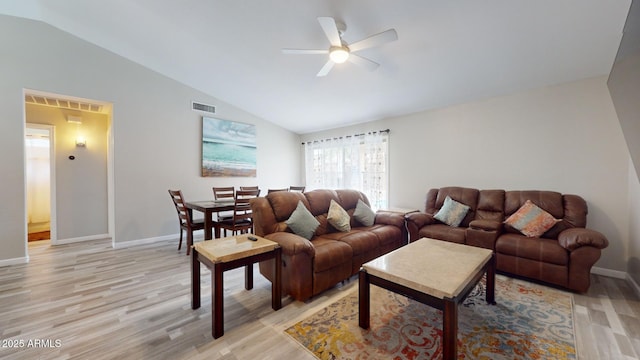 living room featuring light wood-type flooring, vaulted ceiling, and ceiling fan