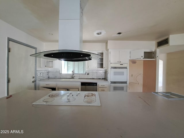 kitchen featuring white appliances, visible vents, decorative backsplash, open shelves, and a sink