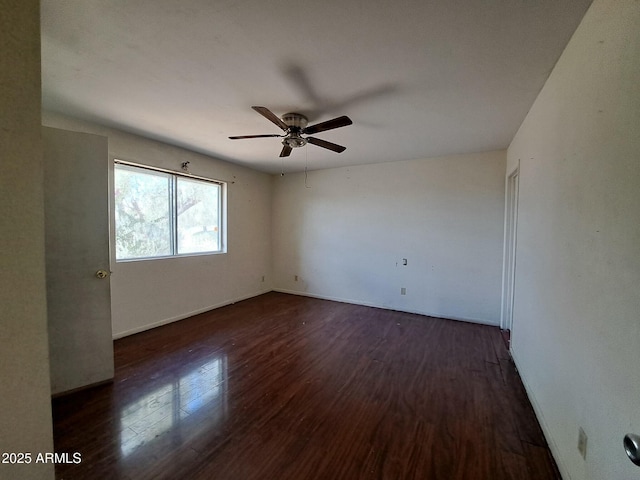 unfurnished room featuring a ceiling fan and wood finished floors