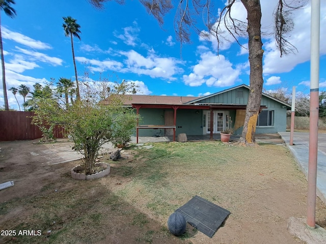 view of front of house with fence