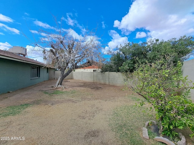 view of yard with a fenced backyard