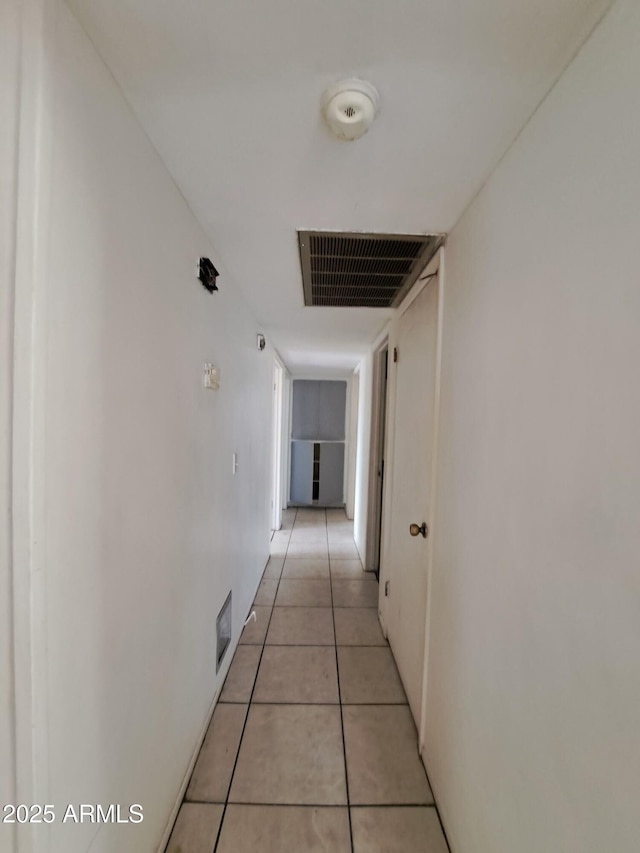 hallway with light tile patterned floors and visible vents