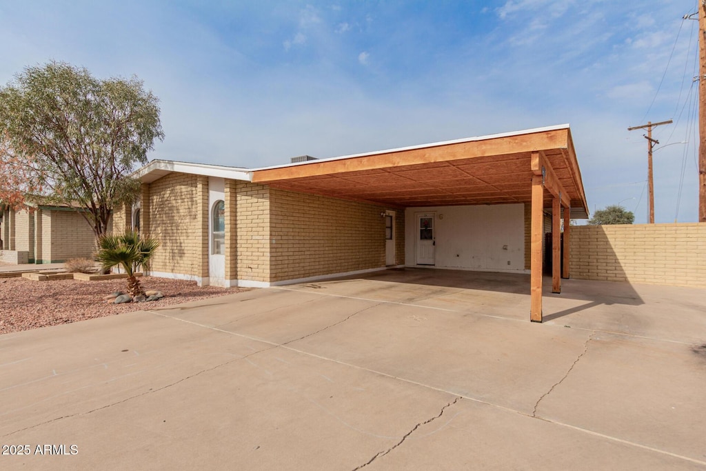 view of front facade with a carport