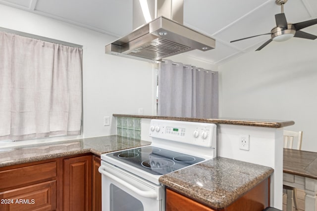 kitchen featuring island range hood, kitchen peninsula, ceiling fan, white electric stove, and stone counters