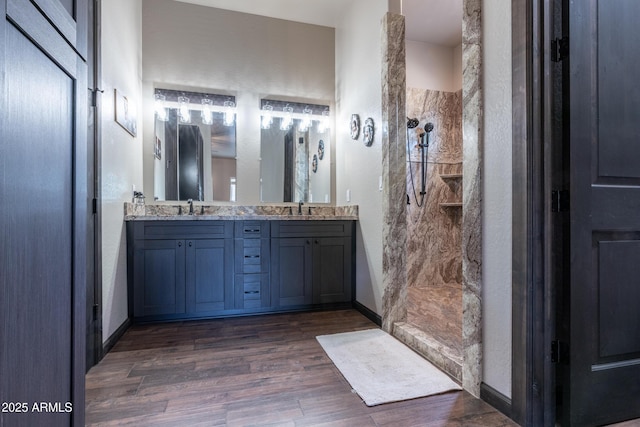 670 S Mountain Pines Ave, Show Low, AZ 85901 - bathroom with a walk in shower, wood finished floors, and double vanity