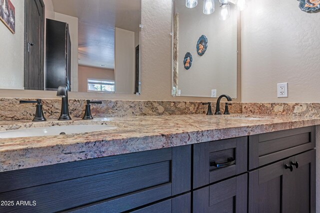 670 S Mountain Pines Ave, Show Low, AZ 85901 - full bathroom with double vanity and a textured wall
