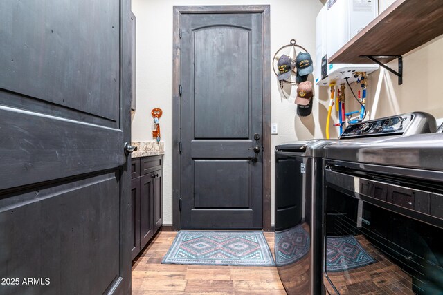 670 S Mountain Pines Ave, Show Low, AZ 85901 - washroom featuring washer and clothes dryer and light wood-type flooring