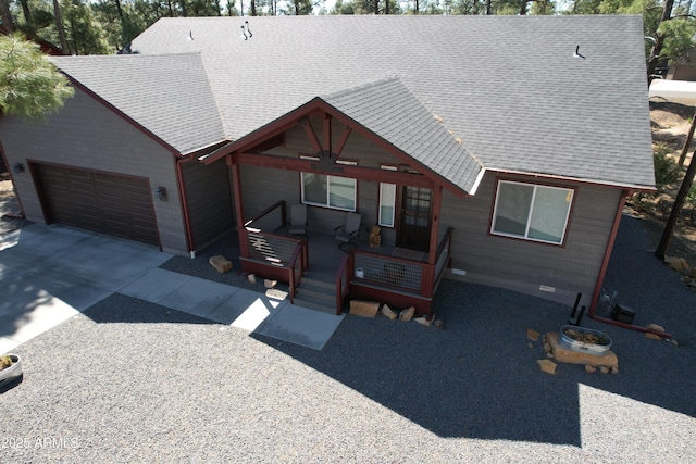 670 S Mountain Pines Ave, Show Low, AZ 85901 - view of front of property featuring a garage, a ceiling fan, concrete driveway, and roof with shingles