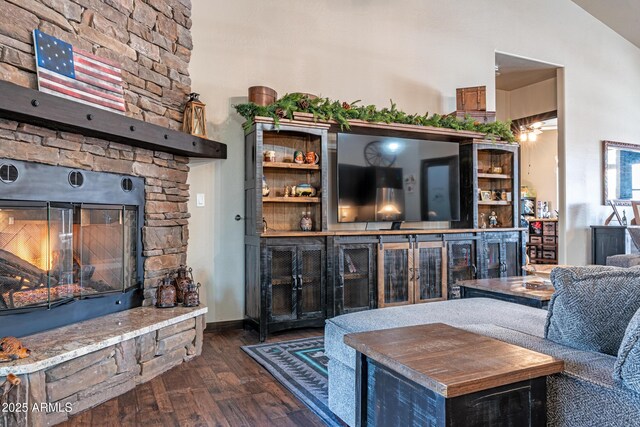670 S Mountain Pines Ave, Show Low, AZ 85901 - living area with wood finished floors, a stone fireplace, and vaulted ceiling