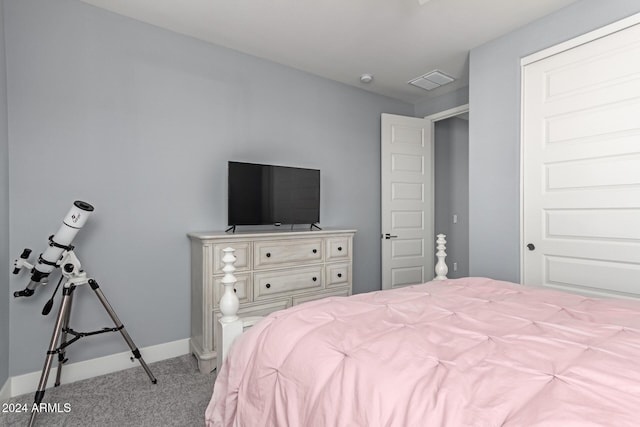 bedroom featuring light colored carpet