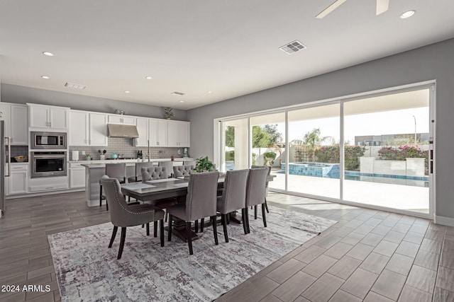 dining space with ceiling fan