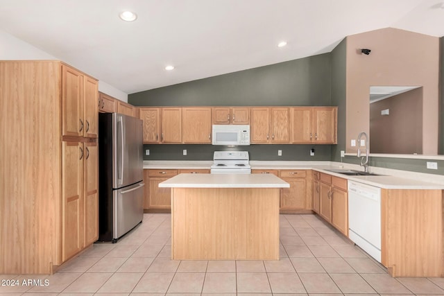 kitchen with sink, a center island, vaulted ceiling, white appliances, and light tile patterned floors