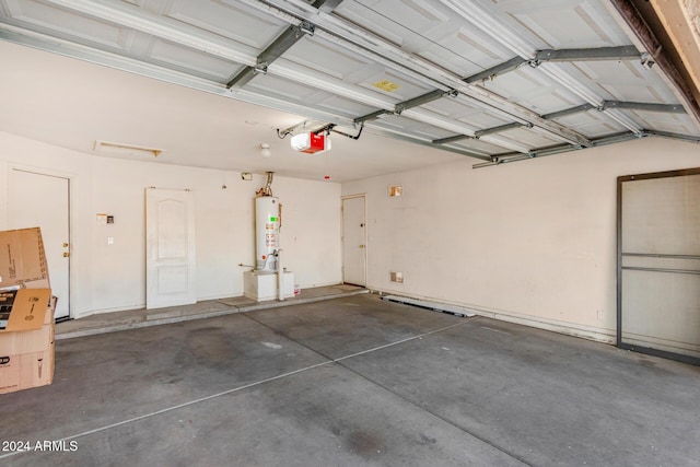 garage with water heater and a garage door opener