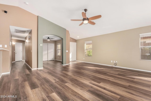 unfurnished room with ceiling fan, dark hardwood / wood-style flooring, and lofted ceiling