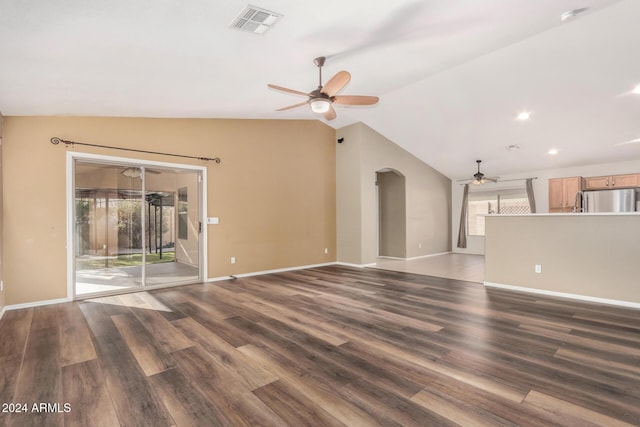 unfurnished living room with ceiling fan, dark hardwood / wood-style flooring, and vaulted ceiling