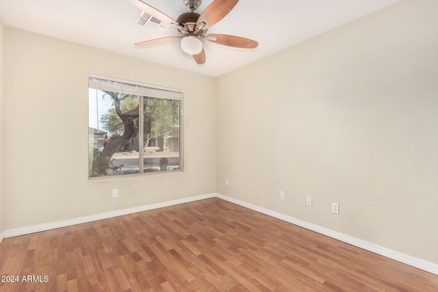 spare room featuring ceiling fan and hardwood / wood-style floors