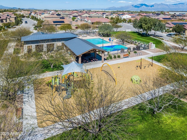 aerial view featuring a mountain view and a residential view