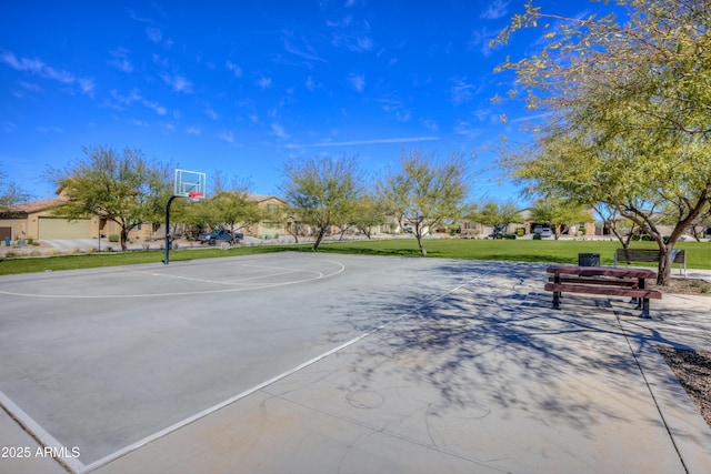 view of basketball court with a yard and community basketball court