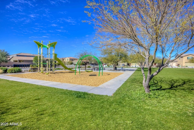 communal playground featuring a lawn