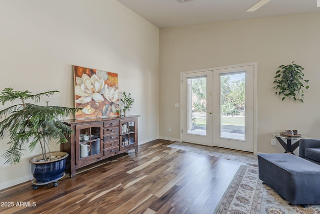 entryway with french doors, baseboards, and wood finished floors