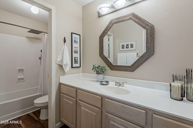 full bathroom with shower / tub combo, toilet, wood finished floors, and vanity